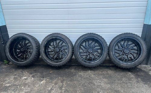 TIS 544 BLACK WHEELS RIMS 35/12.50R24 RT TIRES CHEVY GMC DENALI 2500 HD SET OF 4